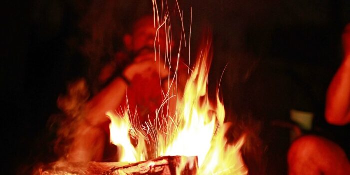 burning trash in campfire
