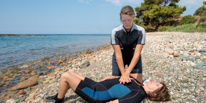 giving cpr on the beach