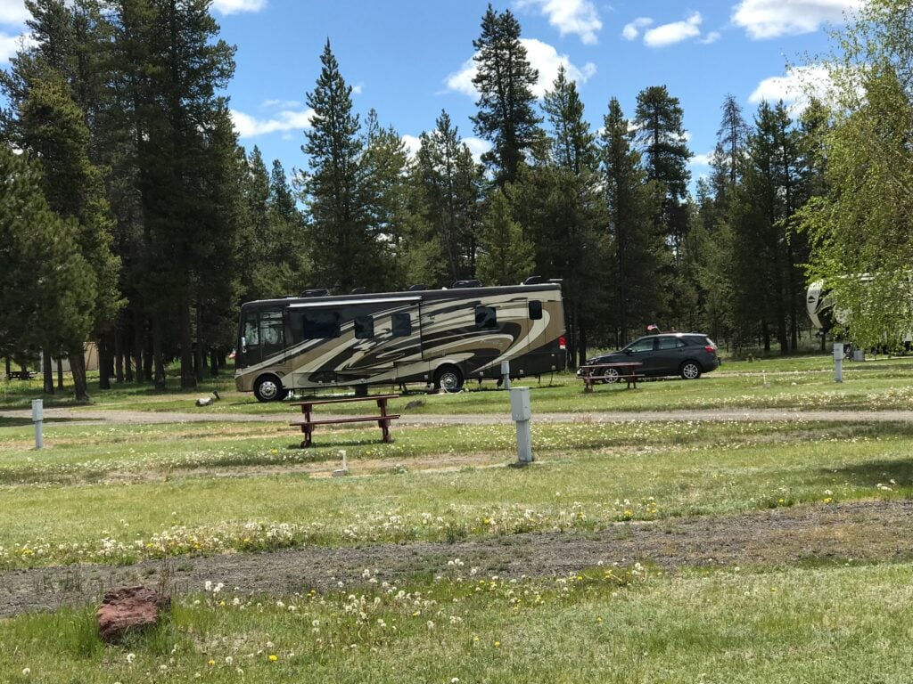 Large class A motorhome in nearly empty campground.