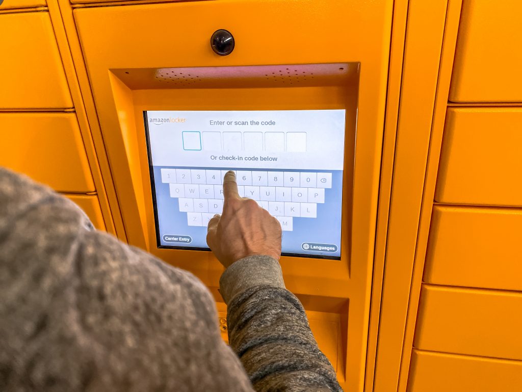 man using an Amazon locker to get mail when RVing