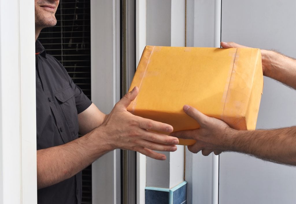 Man receiving a package from the campground, an easy way to get mail when RVing