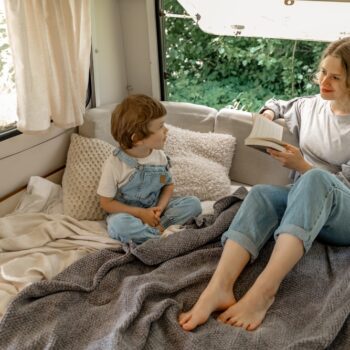 mother and child in an RV trailer