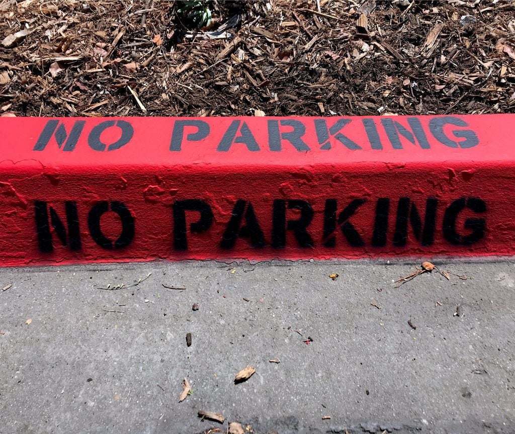 No Parking painted in a red curb. Watch out for certain street laws when moochdocking. 