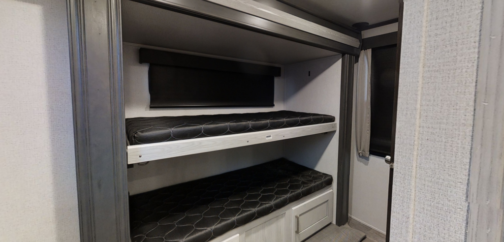 Interior bunk room of the Keystone Montana 335BH. This is one of the best RV for full time family living.