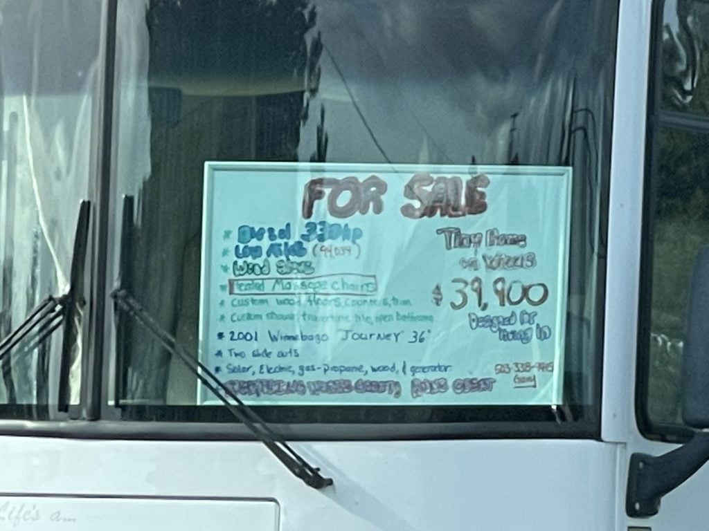 FOR SALE sign in the window of an RV