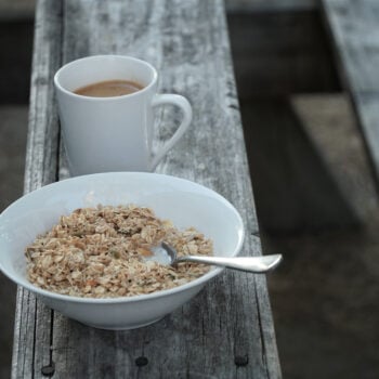 oatmeal on picnic table with coffee mug