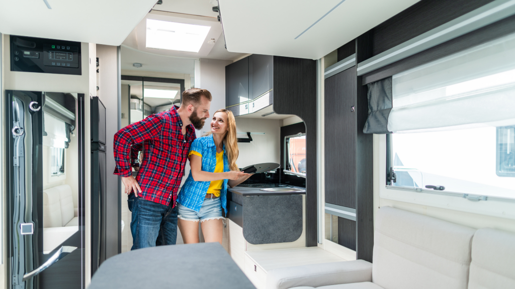 man and woman in a brand new RV