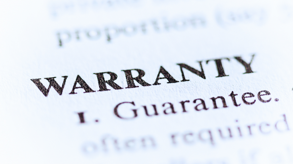 close up shot of a paper with the word "warranty" on it. Not getting a warranty is one of the common RV buying mistakes. 