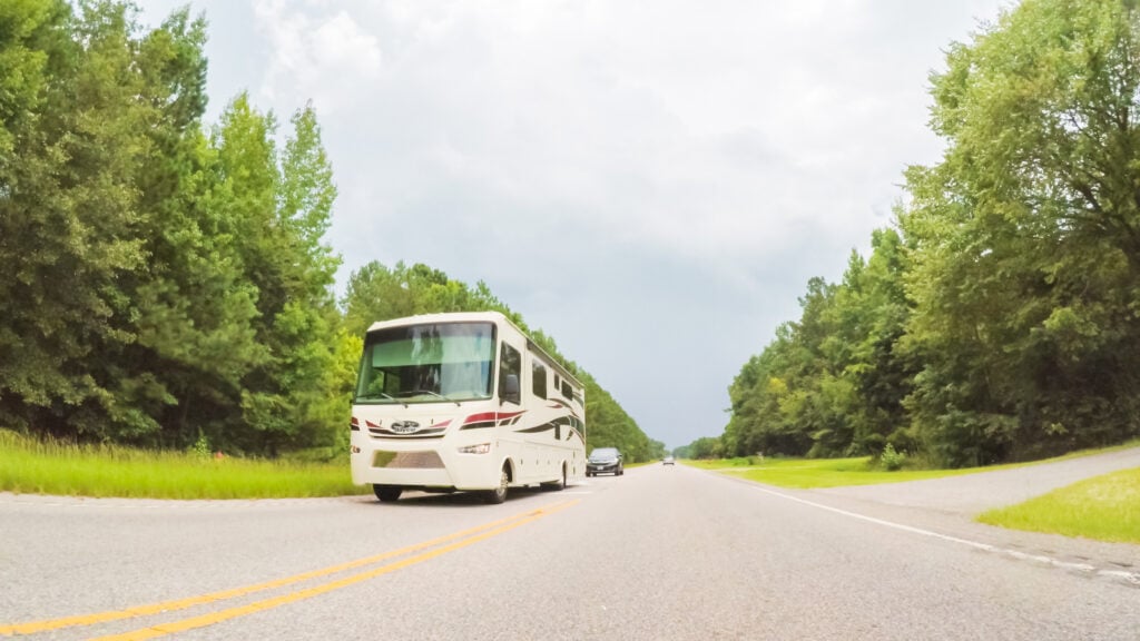 RV driving on highway to go camping in South Carolina