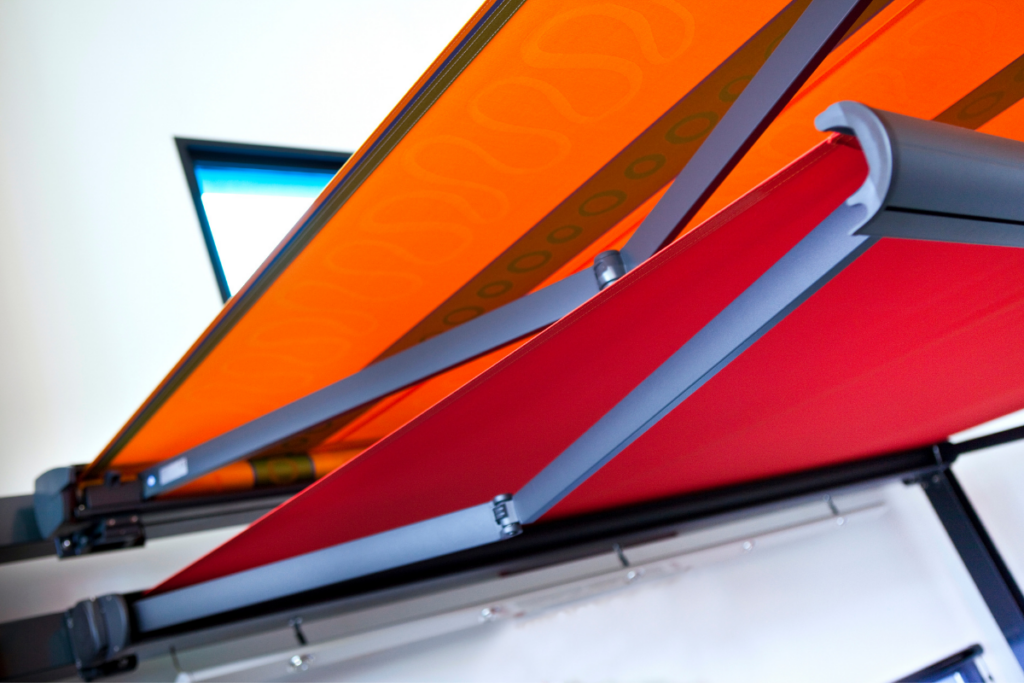 orange and red rv awnings with an RV awning wind sensor