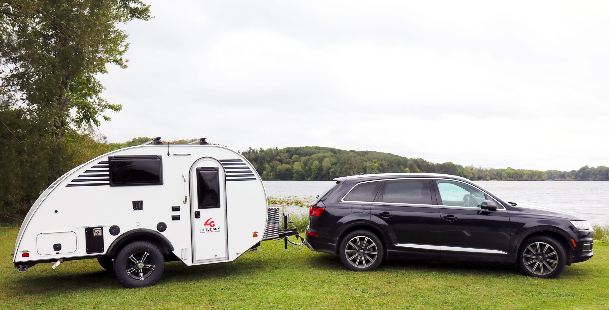Ultra-lightweight Little Guy travel trailer hitched to black SUV