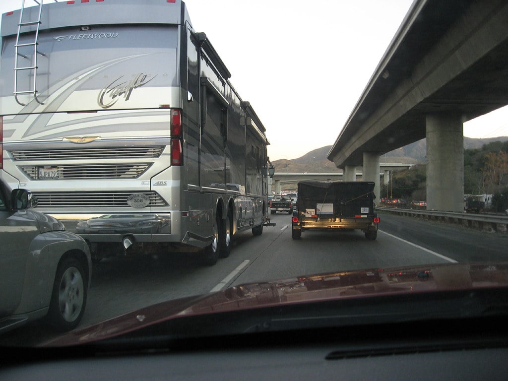 large Class A RV stopped in traffic