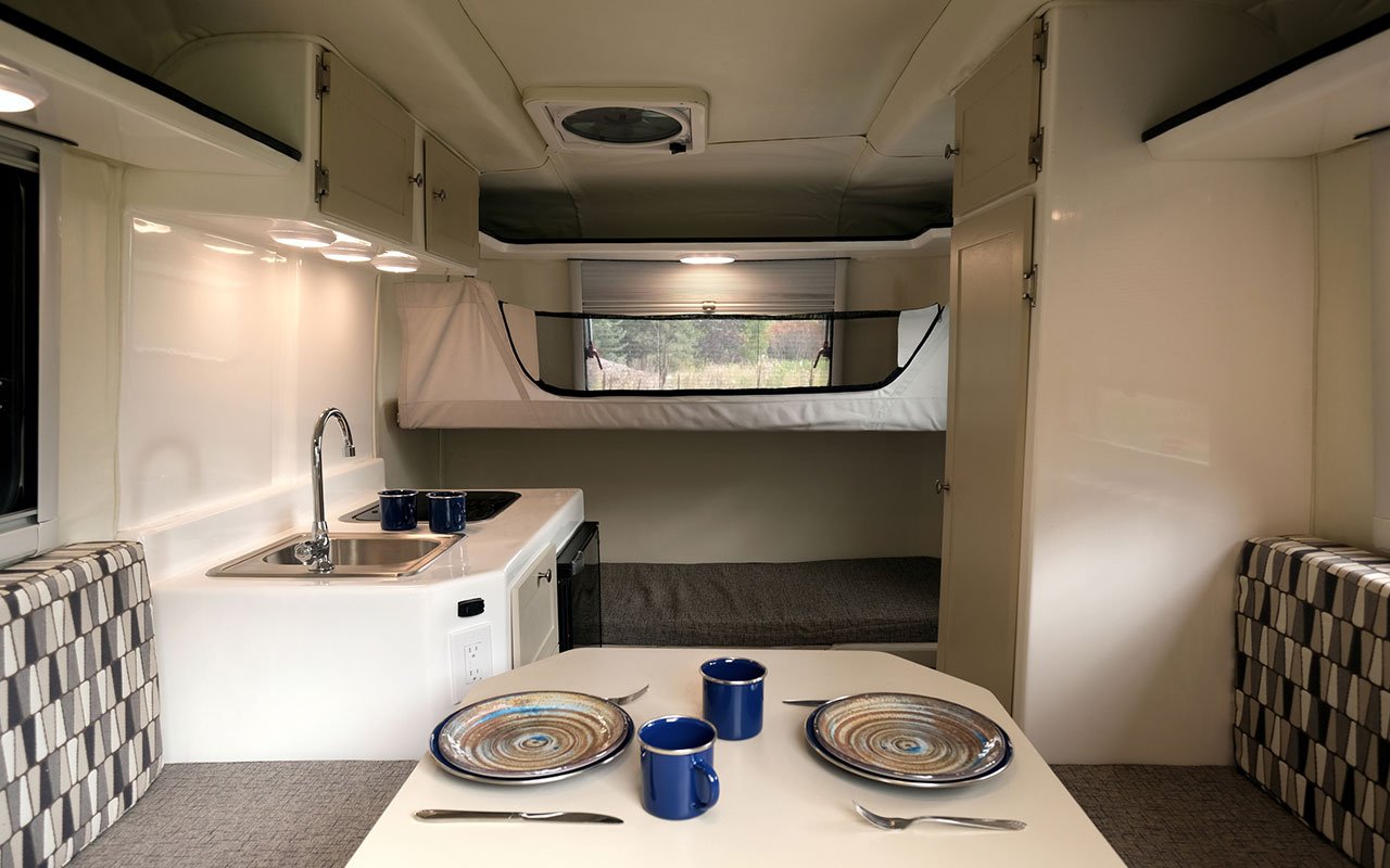 inside kitchen and living area of lightweight travel trailer