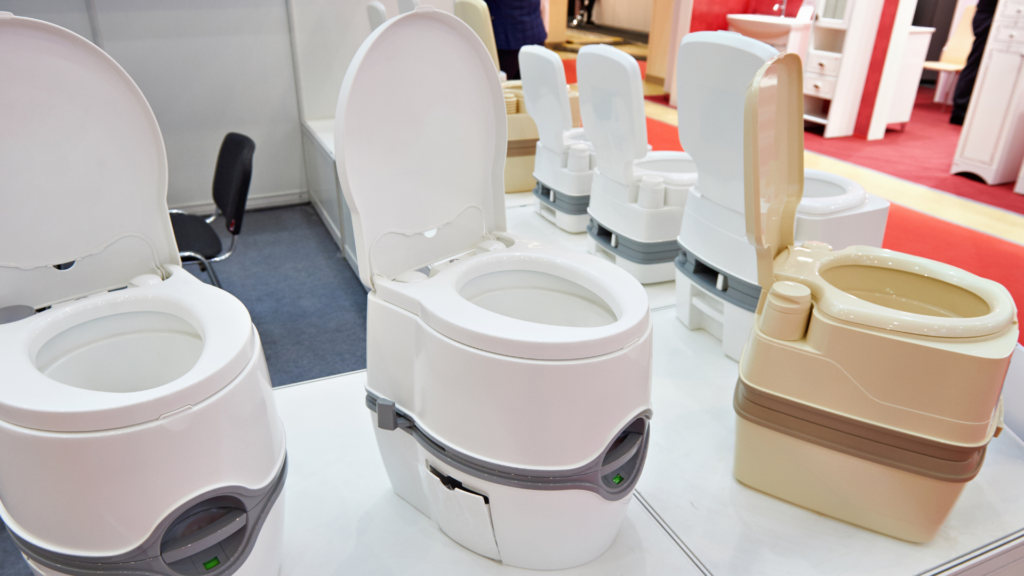 Composting toilets on display at an RV show. Switching to a composting toilet is a great RV boondocking hacks