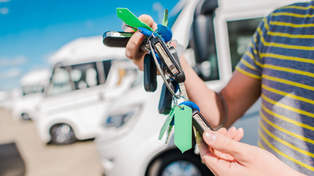 A personal at a dealership buying an RV out of state holding the RV keys