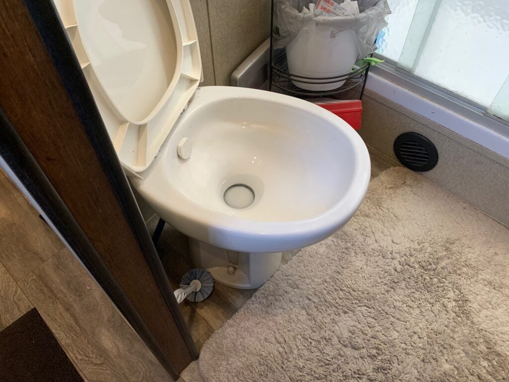 white RV toilet in RV bathroom