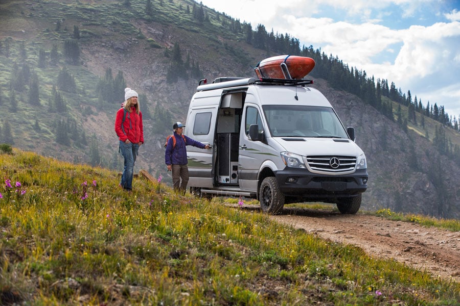 two people with camper van