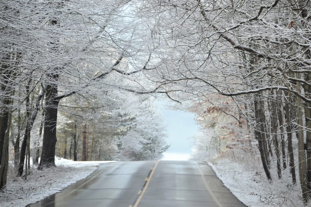 A road with snow on the ground. The winter months can be one of the best time to buy an RV.