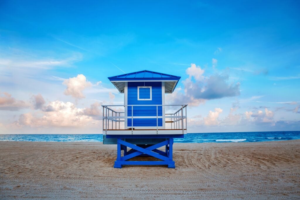 A blue lifeguard house on the florida coast.