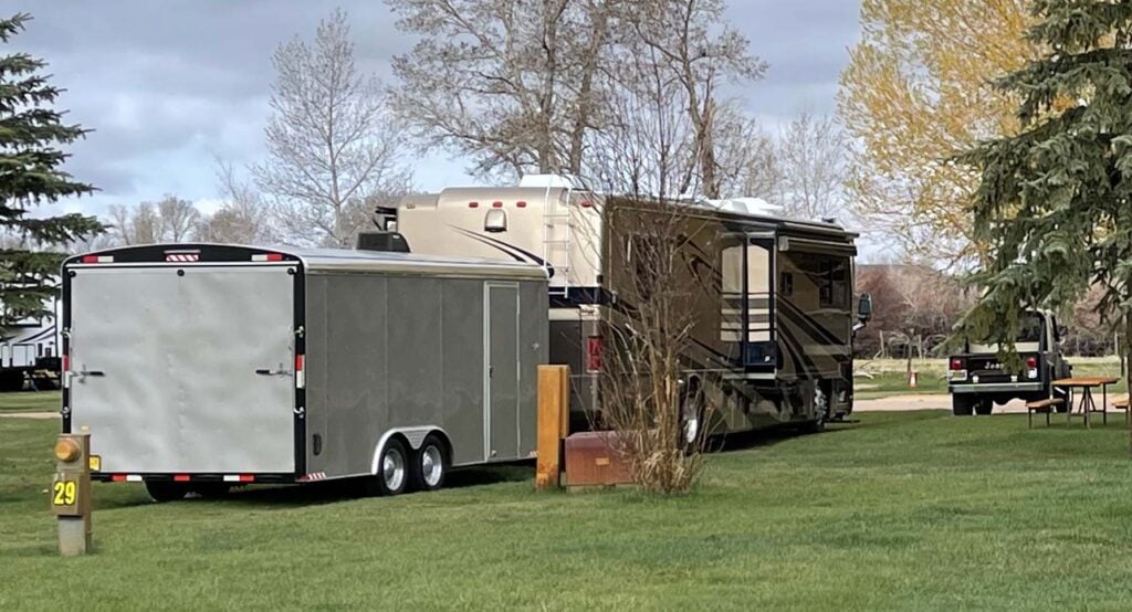Large motorhome towing a trailer