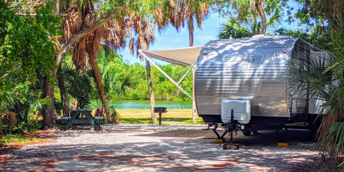 travel trailer at campsite at one of the best RV resorts in Florida
