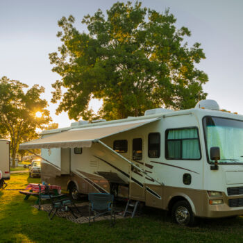 RV at campsite with RV outdoor rugs