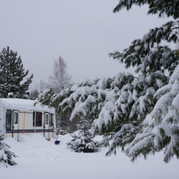 how to winterize an RV - RV covered in snow