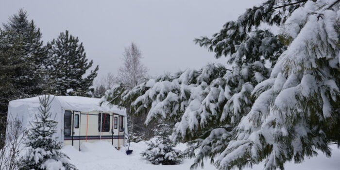 how to winterize an RV - RV covered in snow