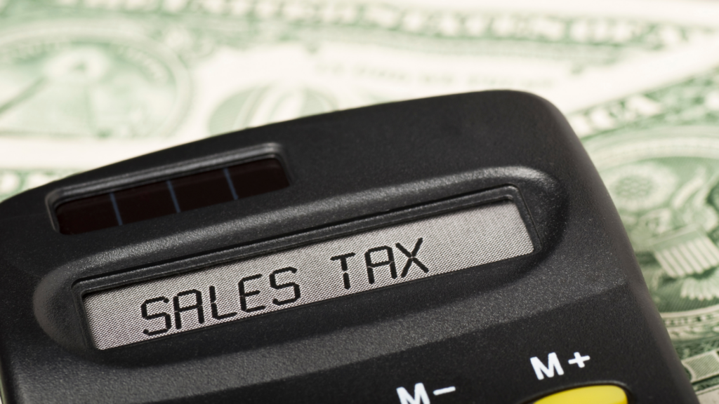 A calculator showing the words "sales tax". When buying an RV out of state you can avoid paying sales tax.