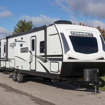 travel trailer at dealership - cover photo for Questions To Ask Before Buying An RV Out Of State
