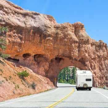 RV going through arch in Utah - one of our favorite RV trip ideas