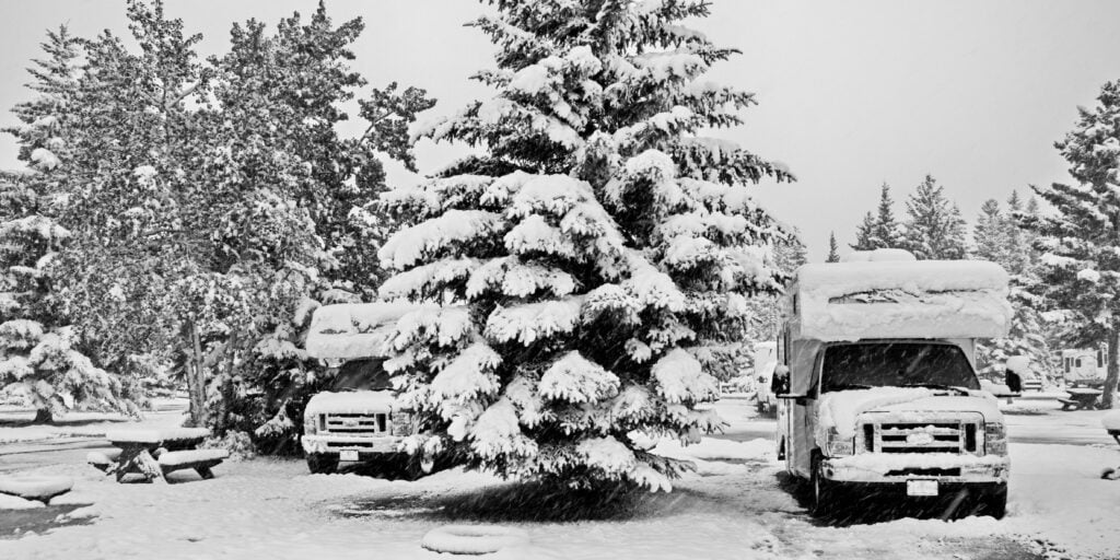 RVs covered in snow at campground