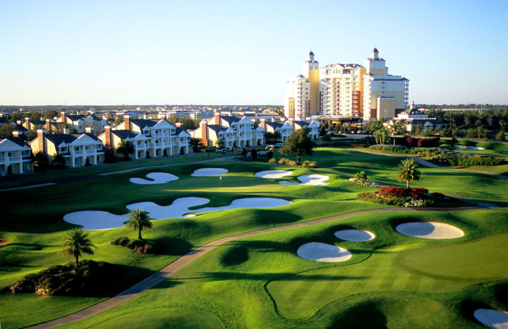 This beautiful green golf course against a blue sky is the epitome of RVing in Florida