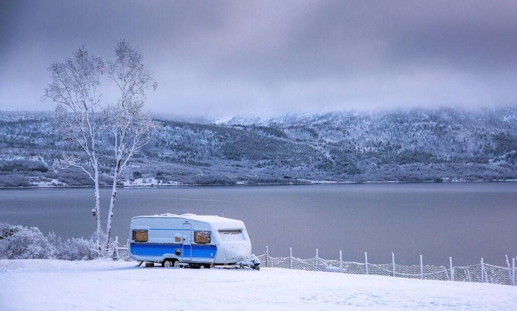 travel trailer covered with snow signifies that now is the time to buy or sell your rv