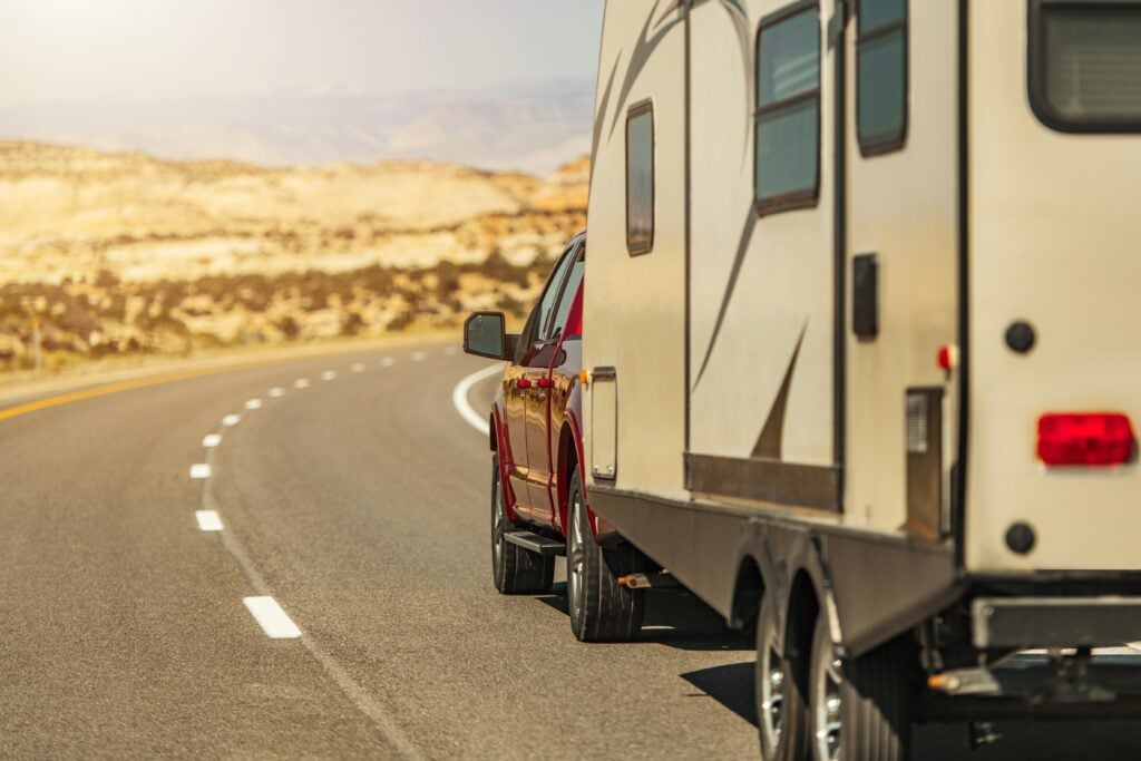 travel trailer pulled behind car - feature photo for What I Wish I Knew Before Full Time RVing