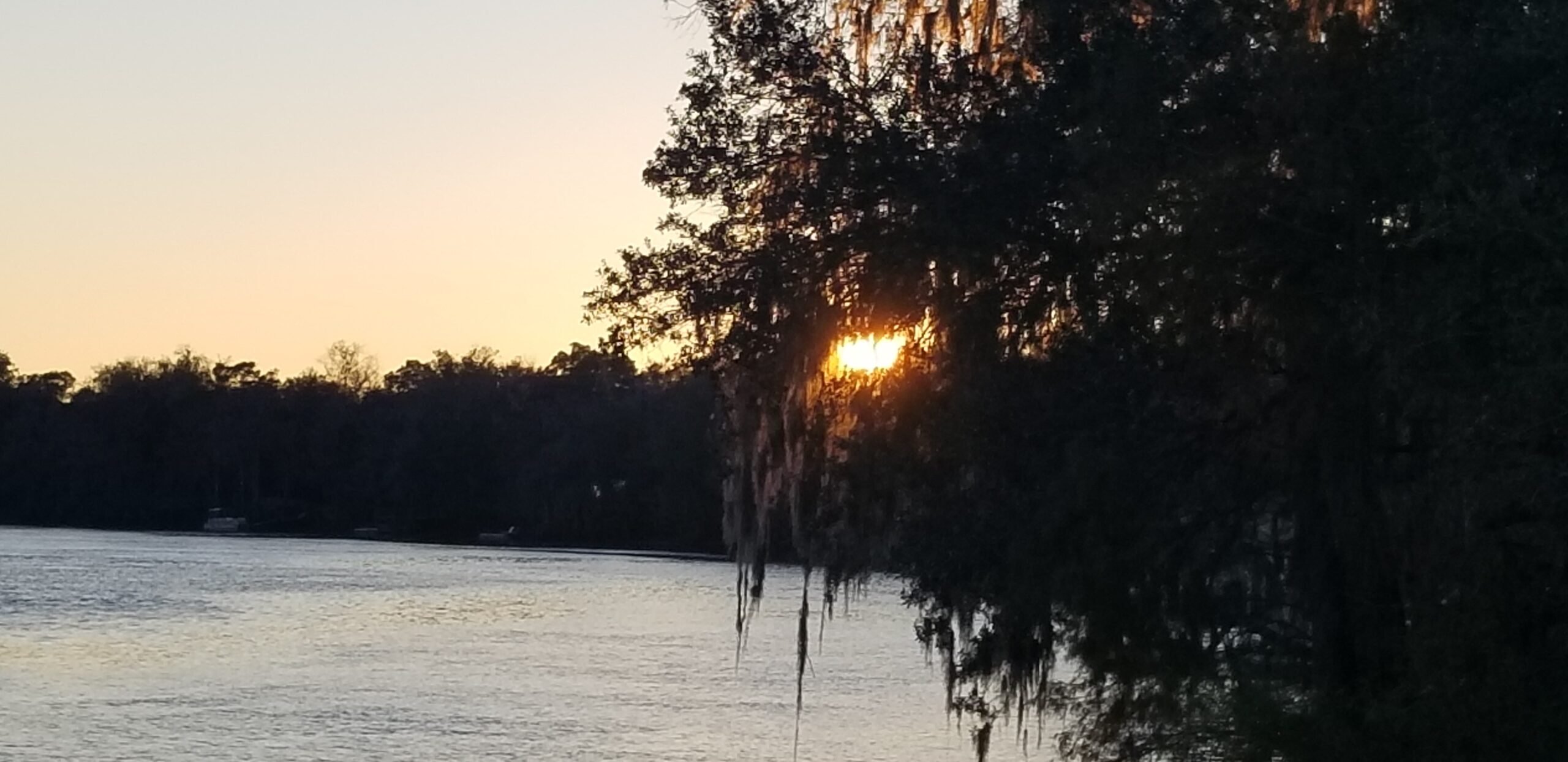 view of the water and sunset from Florida, one of the best places to go RVing in the spring