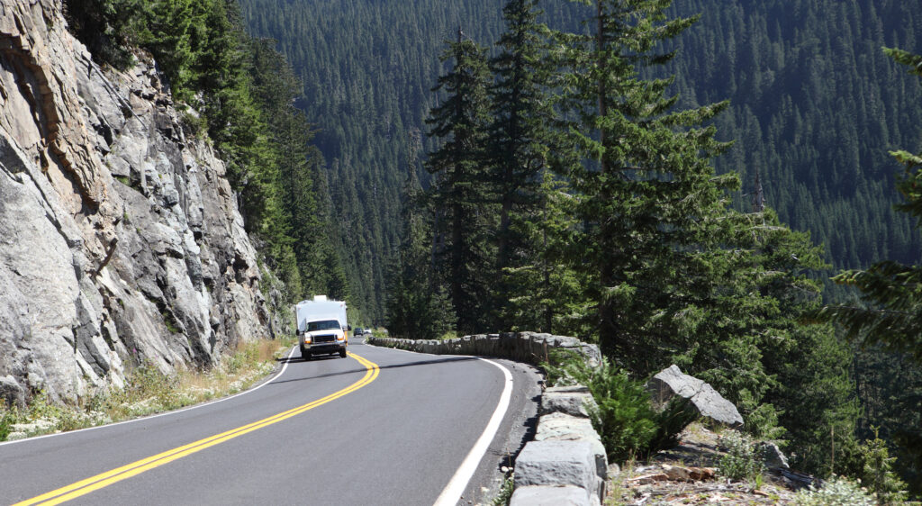 pickup pulling RV on mountain pass