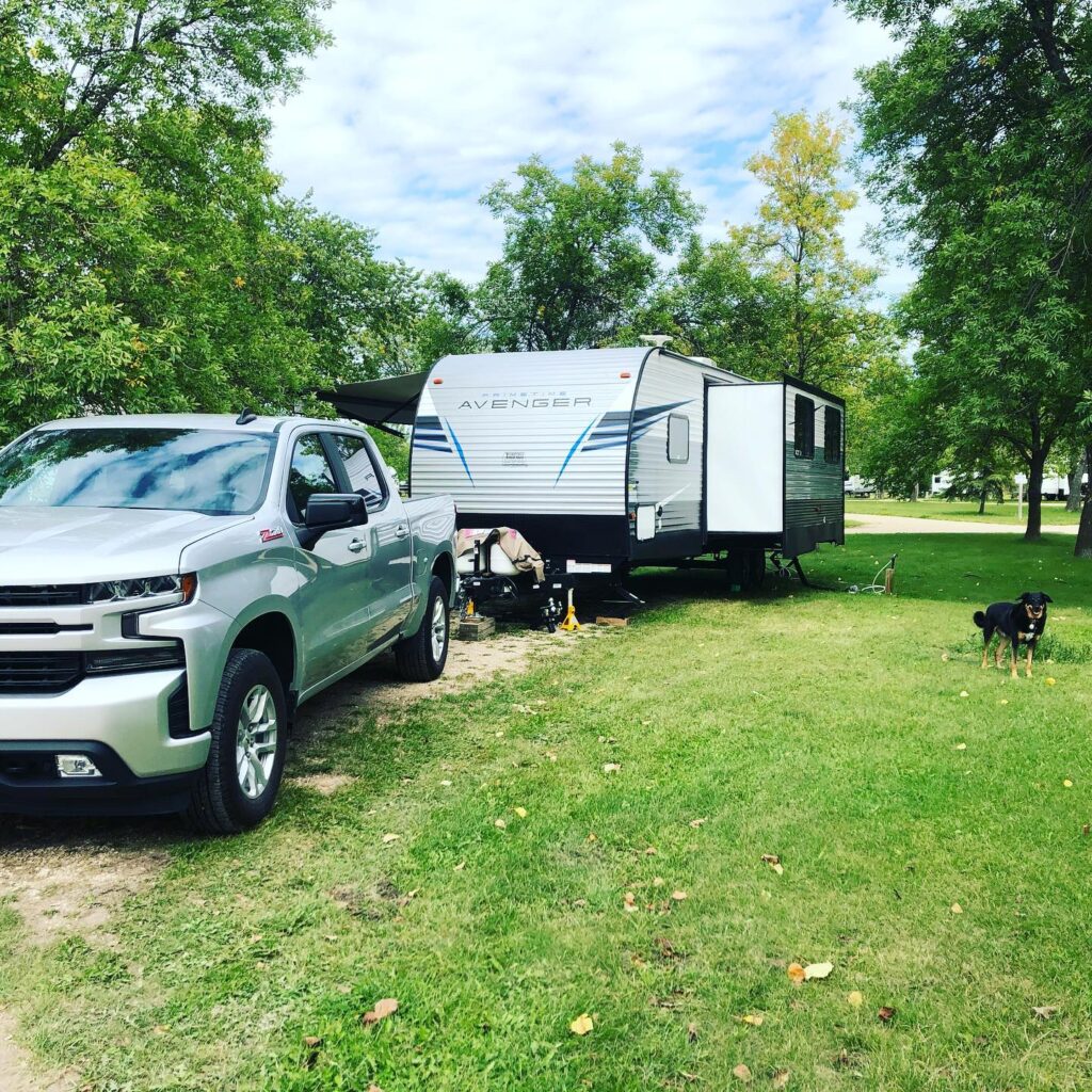 pickup truck with travel trailer with slideout and dog