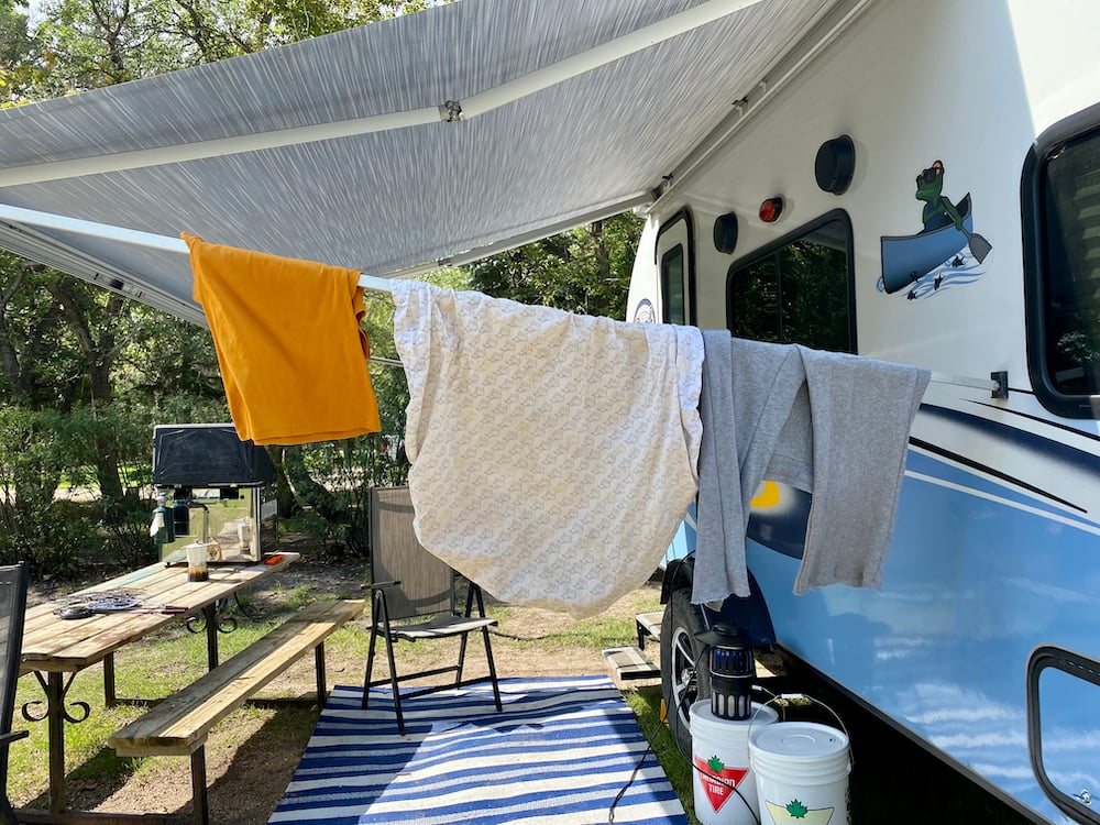 laundry hanging on travel trailer awning - feature image for RVing hacks