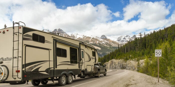 large RV being towed in canada - feature image for What Length RV Should I Buy