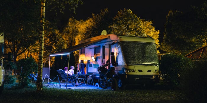 RV at night with lights on inside and RV security system