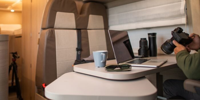 man on laptop in RV - feature image for how to make money while RVing