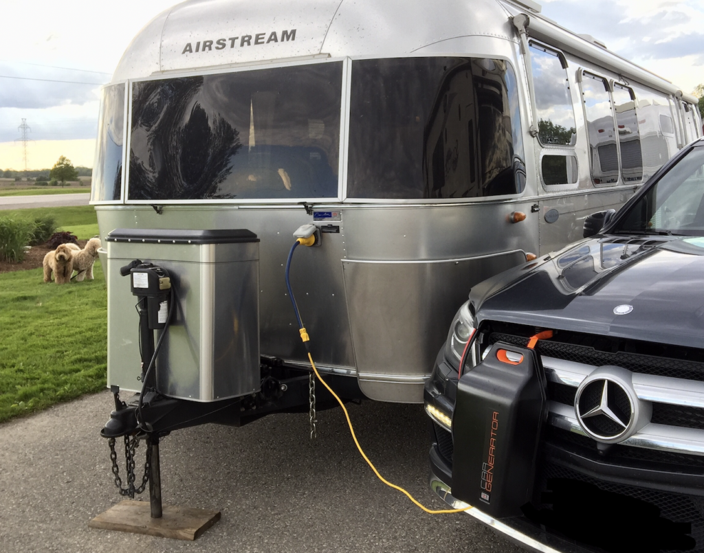Airstream plugged into a CarGenerator on a cloudy day as an alternative power source to solar
