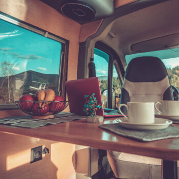 cups of coffee on a table in a small rv