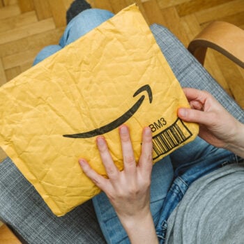 arm holding Amazon packages