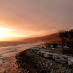 sunset over coastal campsites on the west coast