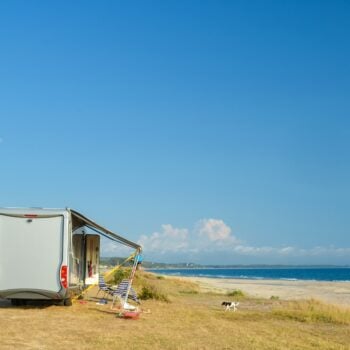 RV in the summer by the beach - feature image for how to stay cool without AC