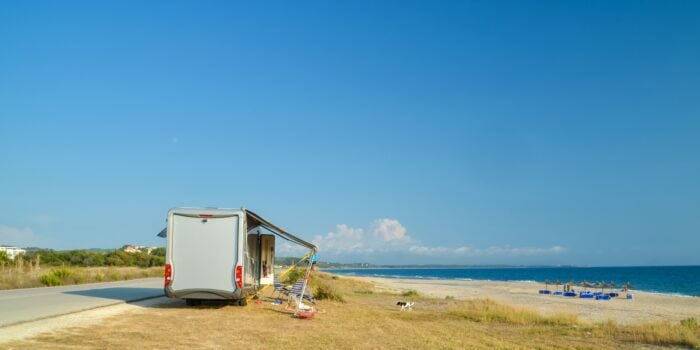 RV in the summer by the beach - feature image for how to stay cool without AC