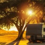sun at campsite - feature image for heat exhaustion symptoms while RVing