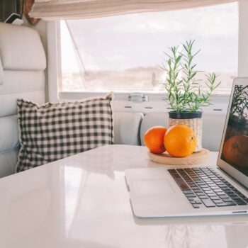 laptop in RV - feature image for seasonal jobs for full time RVers